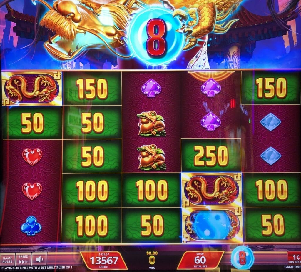 Dragon Spell by IGT dragon symbol with orb