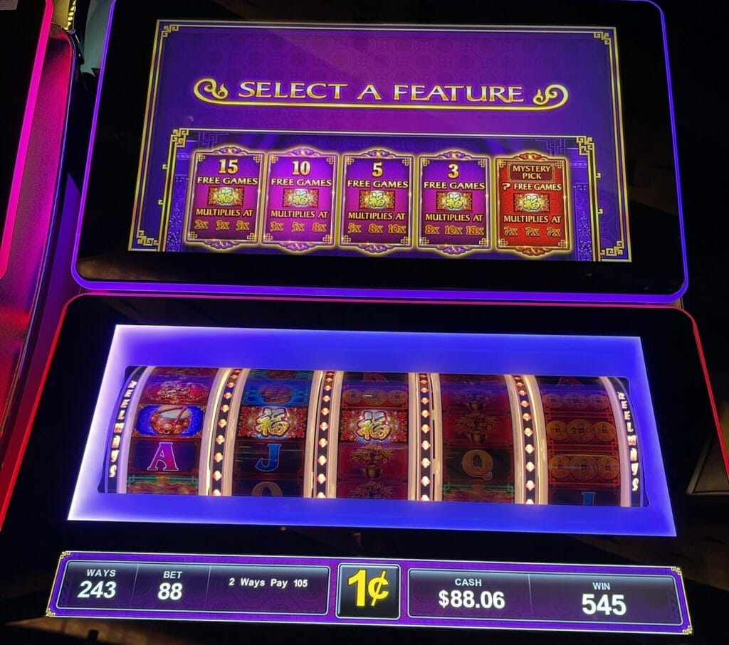 Dancing Drums Reels by Scientific Games select a feature