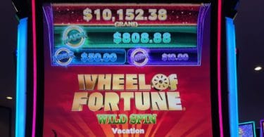 Wheel of Fortune Wild Spin by IGT logo and progressives