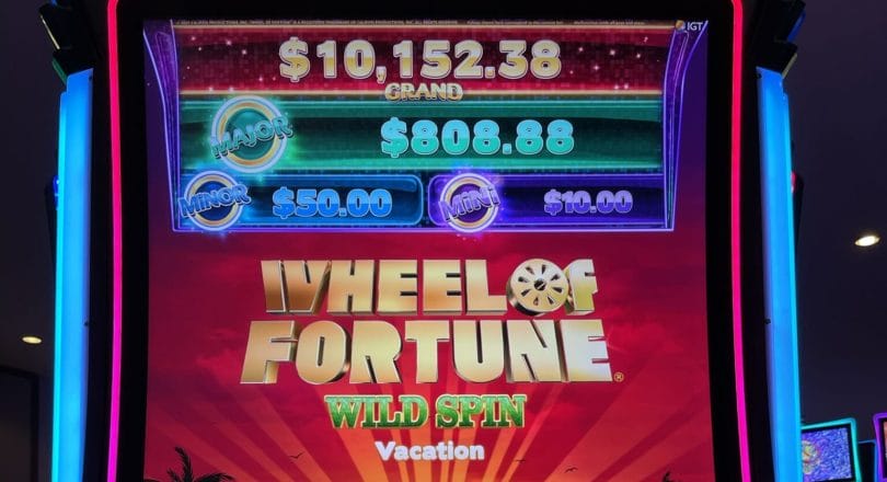 Wheel of Fortune Wild Spin by IGT logo and progressives