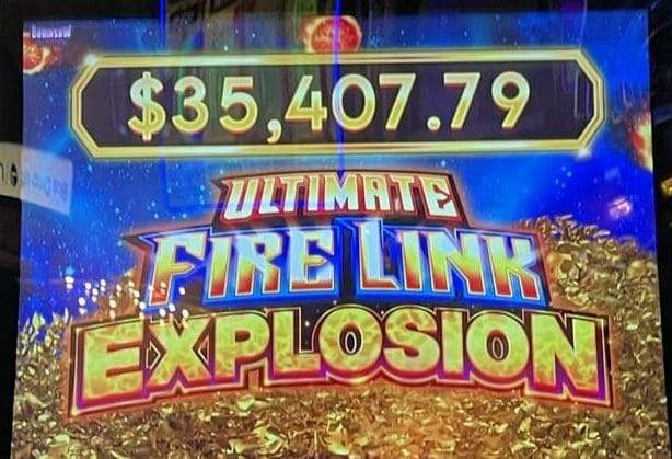 Ultimate Fire Link Explosion by Light and Wonder logo and Explosion progressive